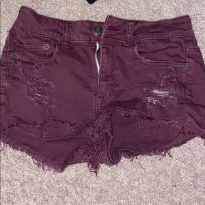 Burgundy ripped jean shorts